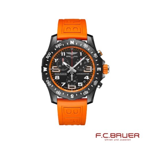 Eine Breitling Professional Endurance Pro x82310a51b1s1 Chronometeruhr mit orangefarbenem Gummiarmband und schwarzer Lünette. Das Zifferblatt zeigt verschiedene Zeitanzeigen und Zifferblätter. Das Logo „Juwelier Bauer München“ befindet sich in roter Schrift in der unteren rechten Ecke auf weißem Hintergrund.