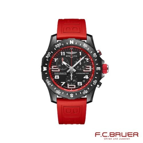 Eine Breitling - Professional Endurance Pro x82310d91b1s1-rot-11555970 Chronometeruhr mit schwarz-rotem Design. Die Uhr verfügt über ein schwarzes Zifferblatt mit weißen Indizes, eine Kompasslünette und ein rotes Gummiarmband. In der unteren rechten Ecke erscheint das Logo „F.C. BAUER Uhren und Juwelen“ von Juwelier Bauer in München.